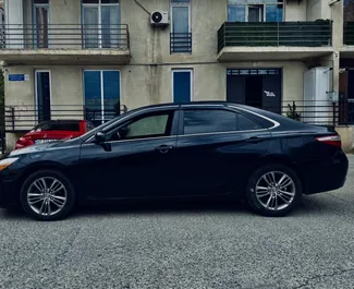 Noleggio Toyota Camry. Auto Comfort, Premium per il noleggio in Georgia ✓ Cauzione di Deposito di 200 GEL ✓ Opzioni assicurative RCT, CDW, SCDW, Passeggeri, Furto, Senza deposito.