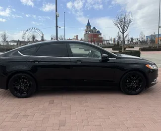 Noleggio Ford Fusion Sedan. Auto Comfort per il noleggio in Armenia ✓ Cauzione di Deposito di 190 USD ✓ Opzioni assicurative RCT, CDW, SCDW, FDW, Passeggeri, Furto, All'estero, Giovane, Senza deposito.