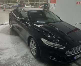 Vista frontale di un noleggio Ford Mondeo a Tbilisi, Georgia ✓ Auto #15789. ✓ Cambio Automatico TM ✓ 0 recensioni.