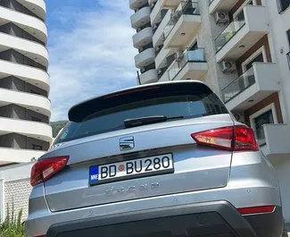 Vista frontale di un noleggio SEAT Arona all'aeroporto di Podgorica, Montenegro ✓ Auto #16088. ✓ Cambio Automatico TM ✓ 0 recensioni.