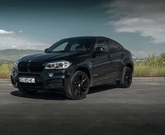 Vista frontale di un noleggio BMW X6 a Tbilisi, Georgia ✓ Auto #16556. ✓ Cambio Automatico TM ✓ 0 recensioni.