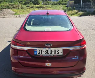 Ford Fusion Sedan 2018 disponibile per il noleggio a Tbilisi, con limite di chilometraggio di illimitato.